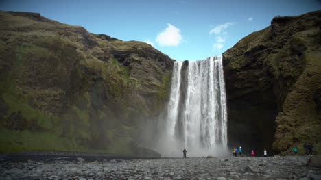 People-at-the-Base-of-Large-Waterfall
