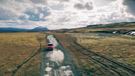 Red-Car-on-A-Dirt-Road