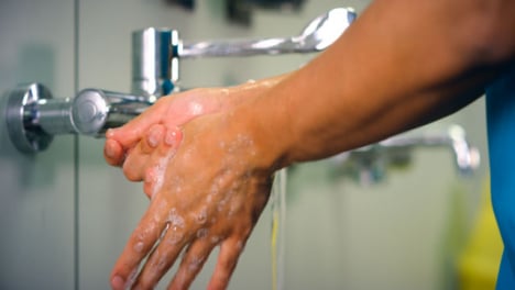 Female-Medical-Worker-Washes-Hands
