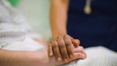 CU-Nurse-Holds-Patient-Hand
